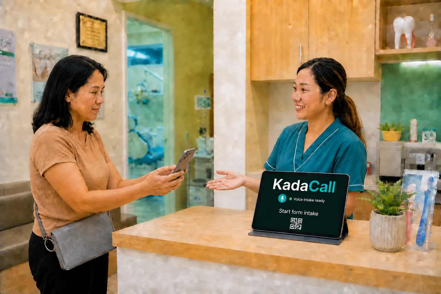 Filipino dental receptionist supporting a walk-in patient scanning the KadaCall form-intake screen at a neighborhood clinic counter.